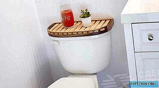 Wooden shelf that is mounted on the toilet bowl