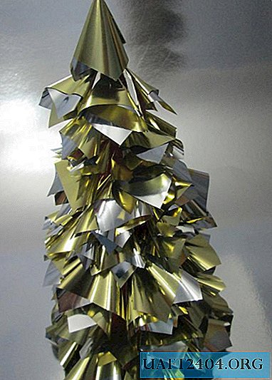 Christmas tree made of golden wrapping paper