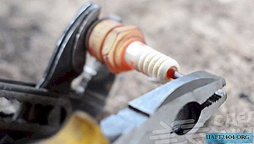 How to remove an insulator from a car spark plug