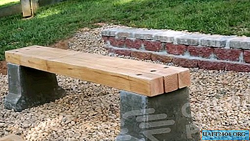 Masyvus lauko suolas, pagamintas iš cemento ir medžio