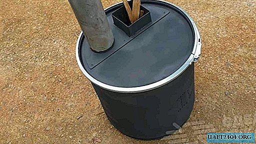 Pequeña estufa de bricolaje de un cubo de metal