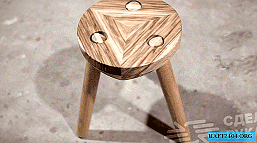 Unusual three-legged wooden stool