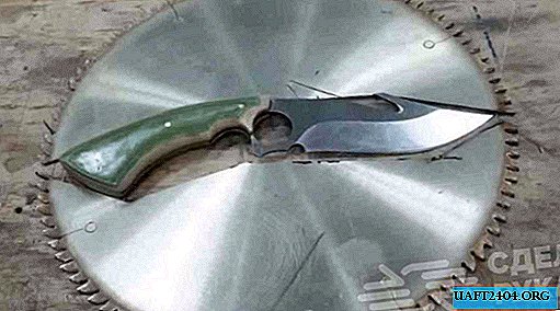 Couteau original d'un disque de scie et avec un manche de Mikarta