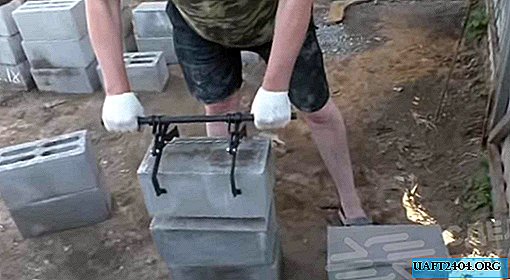 Le dispositif pour la pose de gros blocs de sable-ciment