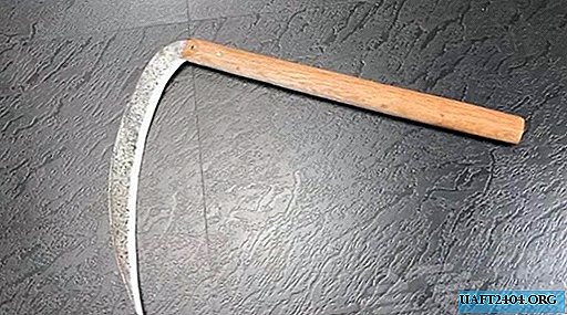 Homemade scythe-serpan with a handle from an old shovel