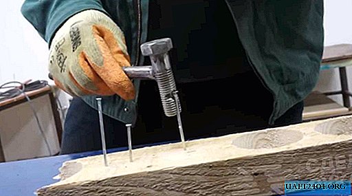 Zelfgemaakte "mondstuk" voor een hamer van een gewone bout