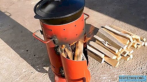 Fogão caseiro de um extintor de incêndio sob um caldeirão