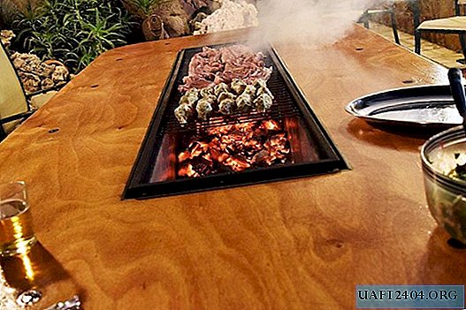Home-made table with built-in barbecue
