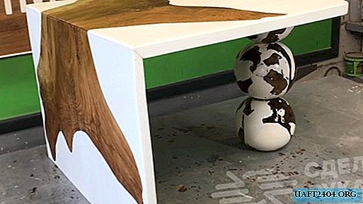 Stylish table made of old oak and white epoxy