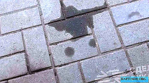Removing oil stains from concrete and paving slabs