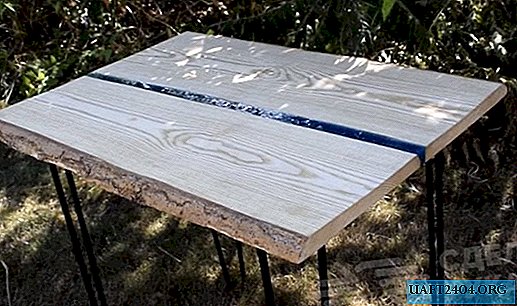 Outdoor table made of wood, metal and epoxy